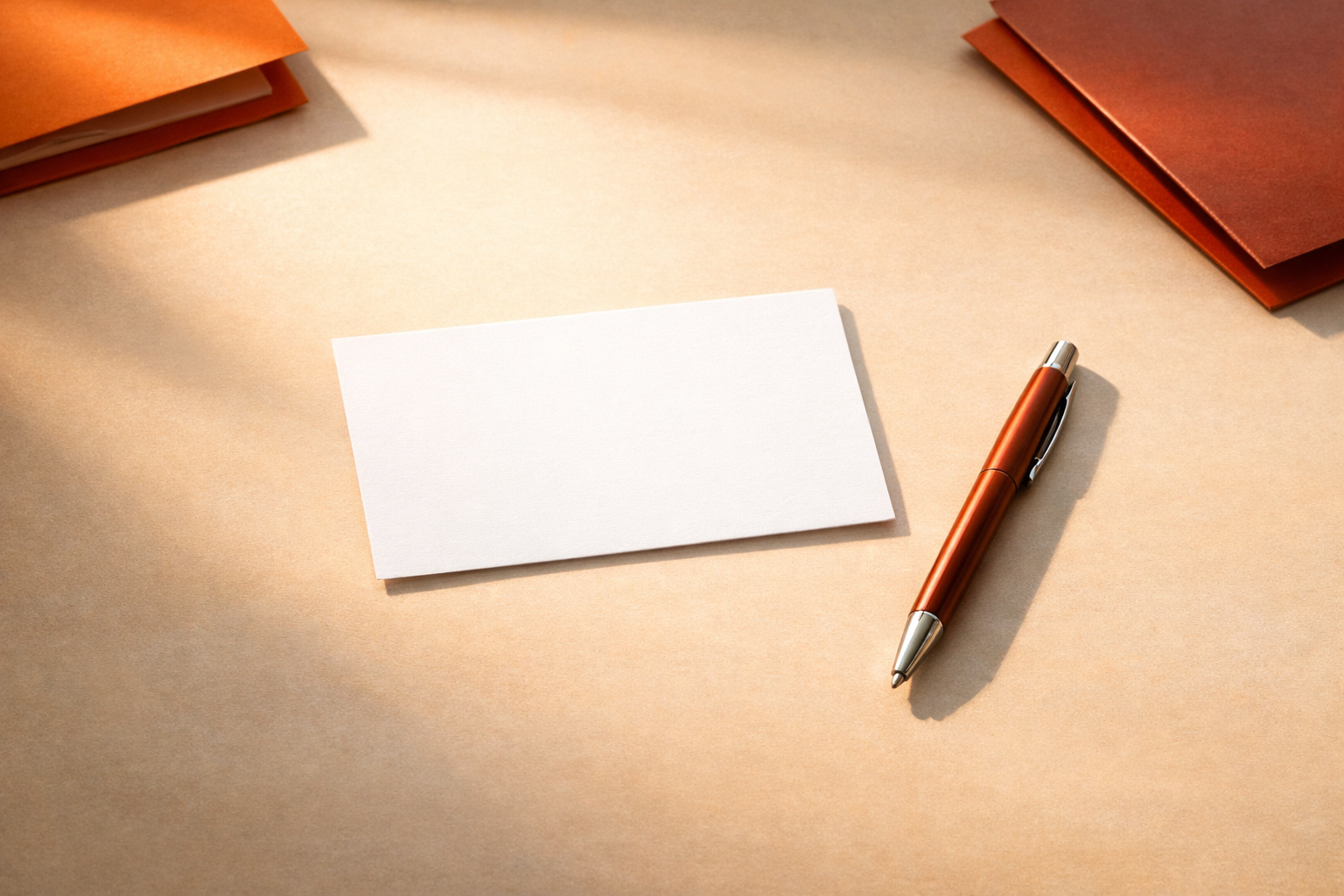 A single, untouched briefing card rests at the center of a light-orange-washed desk. A pen lies nearby, angled as if just set down. Soft, directional light from the side. No words, numbers, or faces—just the invitation to begin the week’s priority brief.
